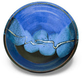Wheel-thrown and high-fired stoneware bowl in cobalt blue and black colors.  Handmade pottery by Prairie Fire Pottery.  Overhead view.