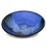 Wheel-thrown and high-fired stoneware bowl in cobalt blue and black colors.  Handmade pottery by Prairie Fire Pottery.  3/4 view.