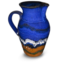 52 ounce wheel-thrown pitcher in cobalt blue and toasted brown.  Handmade pottery by Prairie Fire Pottery.  Hand made in stoneware clay and high-fired to 2400°.  Right side view.