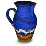 52 ounce wheel-thrown pitcher in cobalt blue and toasted brown.  Handmade pottery by Prairie Fire Pottery.  Hand made in stoneware clay and high-fired to 2400°.  Right side view.