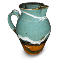 60 ounce wheel-thrown pitcher in turquoise and brown colors.  Handmade pottery crafted in stoneware clay by Prairie Fire Pottery.  Left side view.