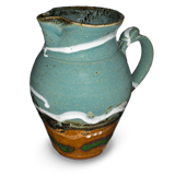 60 ounce wheel-thrown pitcher in turquoise and brown colors.  Handmade pottery crafted in stoneware clay by Prairie Fire Pottery.  Right side view.