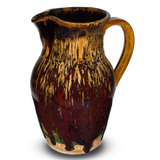 52 ounce handmade pottery pitcher in earth tones and red.  Wheel-thrown pottery fired to 2400° for strength and durability.  Hand made by Prairie Fire Pottery in the U.S.A.  Right side view.