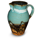 56 ounce high-fired wheel-thrown pitcher in turquoise and brown colors.  It is handmade pottery by Prairie Fire Pottery.  Hand made in stoneware clay.  Right side view.