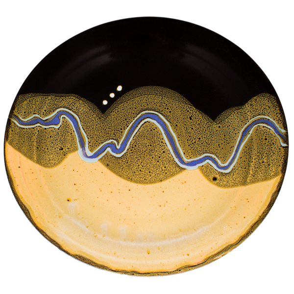 Overhead view of a 14 inch yellow and black serving platter.  It's handmade pottery by Prairie Fire Pottery.  Accented with a meandering blue line.  Hand made in stoneware clay.