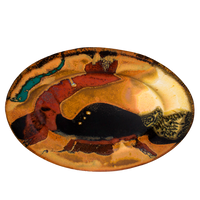 This 9-inch stoneware oval plate is glazed in earth tone colors accented with red and black. It is handmade pottery fired to 2400° by Prairie Fire Pottery. Hand made in the U.S.A.  Overhead view.