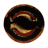 4.5 inch small plate in red and black colors.  Handmade pottery by Prairie Fire Pottery.  Overhead view.