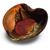 5 inch hand made heart bowl in earth tone colors with red.  Stoneware clay handmade pottery by Prairie Fire Pottery.  3/4 view.
