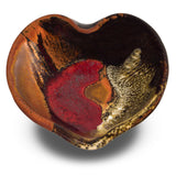 5 inch hand made heart bowl in earth tone colors with red.  Stoneware clay handmade pottery by Prairie Fire Pottery.  Overhead view.