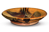 Beautiful handmade pottery bowl in earth tone colors accented with red.  Handmade pottery by Prairie Fire Pottery.  Made in the U.S.A.  Stoneware clay high-fired to 2400°.  Side view.