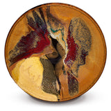 Beautiful handmade pottery bowl in earth tone colors accented with red.  Handmade pottery by Prairie Fire Pottery.  Made in the U.S.A.  Stoneware clay high-fired to 2400°.  Overhead view.