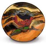 Handmade pottery bowl.  12 inch diamenter.  Earth tone and red colors accented with a ribbon of blue.  Handmade by Prairie Fire Pottery.  Ovberhead view of the bowl.