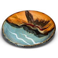 Turquoise and brown stoneware serving bowl. 11 inch diameter. Handmade pottery by Prairie Fire Pottery. Shown in a 3/4 view.