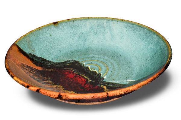 Turquoise and brown stoneware serving bowl. 14 inch diameter. Handmade pottery by Prairie Fire Pottery. Shown in a 3/4 view.
