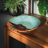 14 inch large stoneware bowl in an elegant home setting.  Handmade pottery by Prairie Fire Pottery.