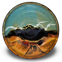 9-inch stoneware bowl. Toasted brown and turquoise colors. Handmade pottery. Stoneware clay. Hand made by Prairie Fire Pottery in U.S.A. Overhead view.