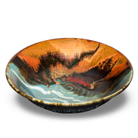 Beautiful 9 inch stoneware bowl in vibrant turquois and toasted brown colors.  Handmade pottery from Prairie Fire Pottery.  Kiln-fired to 2400°.  Made in the U.S.A.  This is a 3/4 view  of the bowl.