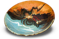 9 and a half inch stoneware bowl in vibrant turquoise and toasted brown colors.  Accented with red and white.  Handmade pottery by Prairie Fire Pottery.  3/4 view.