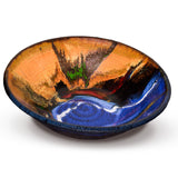 10 inch stoneware bowl from Prairie Fire Pottery.  It is wheel-thrown and high-fired to 2400 degrees.  It is glazed in beautiful cobalt blue over toasted brown  accented with ribbons of white and gold.  This the 3/4 view of the bowl.