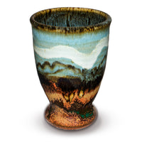 10 ounce turquoise cup accented with toasted orange and ribbons of white.  Handmade pottery by Prairie Fire Pottery.  Hand made in stoneware clay and high-fidred to 2400°.