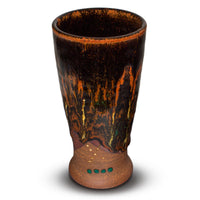 A very pretty 14 ounce stoneware cup in toasted brown and black glazes.  This is handmade pottery from the studio of Prairie Fire Pottery.  Made in the U.S.A.