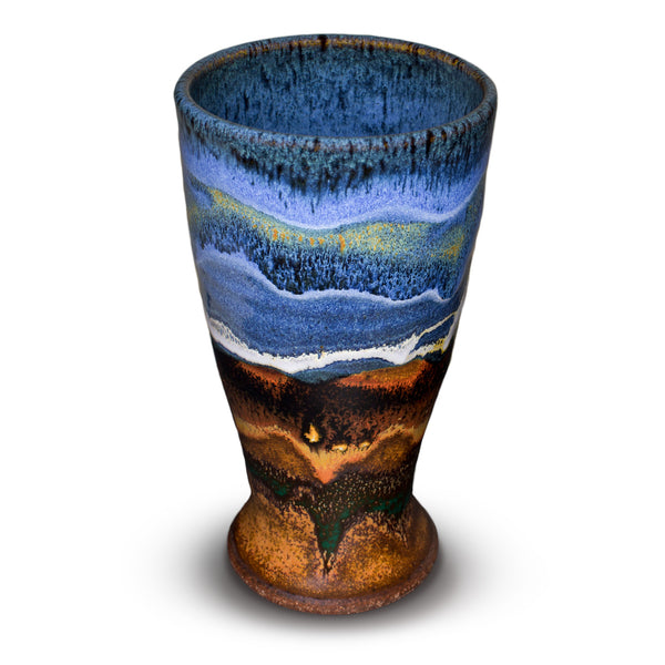 This is a beautiful 16 ounce tall cup in cobalt blue and toasted orange colors.  It is handmade pottery by Prairie Fire Pottery.  Hand made in stoneware clay and kiln-fired to 2400°.