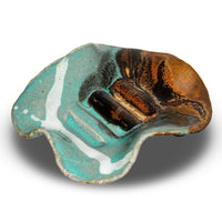Handmade pottery soap dish by Prairie Fire Pottery.  Hand made in stoneware clay and glazed in turquoise and brown colors.  This is a 3/4 view of the soap dish.
