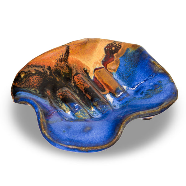 Beautiful cobalt blue and toasted brown colors on a handbuilt soap dish. The is handmade pottery from Prairie Fire Pottery. Stoneware clay. Kiln-fired to 2400°. Made in U.S.A. . This is a 3/4 view of the soap dish.