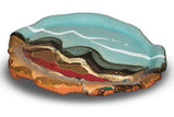14 inch hand build plate crafted in high-fired stoneware clay. Handmade pottery by Prairie Fire Pottery. Turquoise and brown glaze colors accented with red.  3/4 top view.