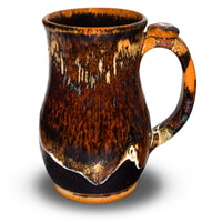 Wheel-thrown stoneware mug. 18 ounce. Handmade pottery by Prairie Fire Pottery. Beautiful earth tone and red glazes. Right side view.