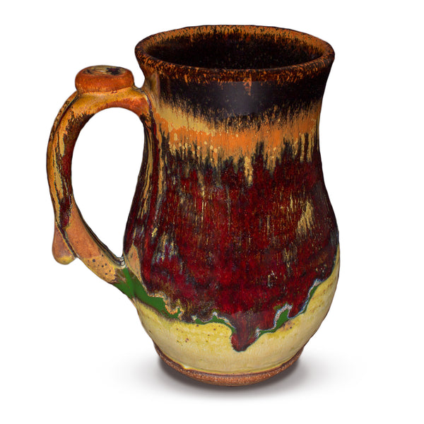 This is the left side view of a stoneware mug in beautiful earth tone and brillant red colors.  It is handmade pottery by Prairie Fire Pottery.