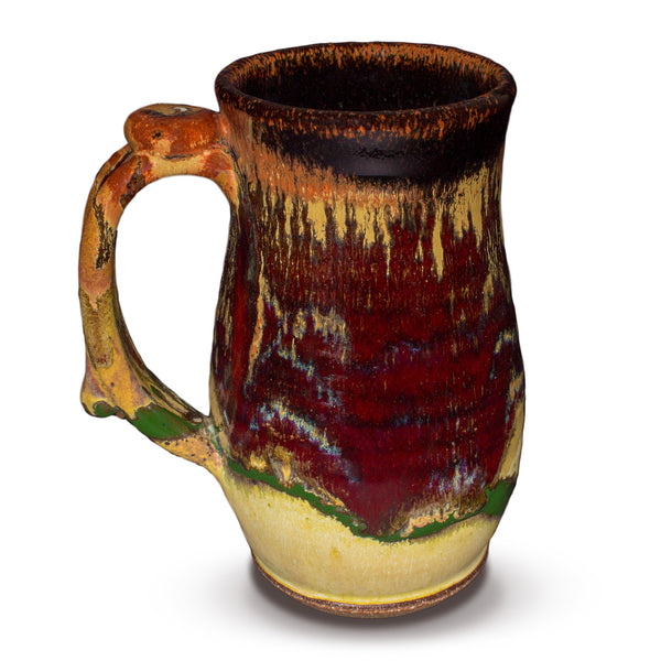 Large 24 ounce tankard mug in earth tone and red glaze colors.  Handmade pottery by Prairie Fire Pottery.  This is the left side view.  Hand made and wheel-thrown in stoneware clay.