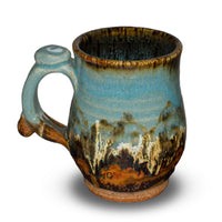 12 ounce handmade pottery mug in turquoise and brown colors. Handmade Pottery. Stoneware clay. Hand made by Prairie Fire Pottery.