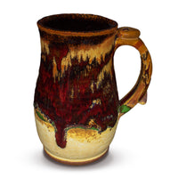 Right side view of a handmade pottery stoneware mug is earth tone and red colors.  It is hand made and wheel-thrown by Prairie Fire Pottery.  Made in the U.S.A