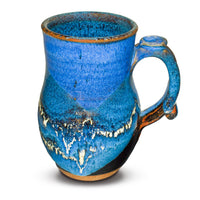 This is an 18-ounce wheel-thrown ceramic mug in cobalt blue and black glaze colors.  It is handmade pottery by Prairie Fire Pottery.  Hand made in the U.S.A.  This view is of the right side of the mug.