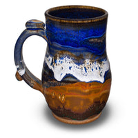 18 ounce stoneware mug in cobalt blue and toasted brown colors.  Handmade pottery by Prairie Fire Pottery.    Right side view.