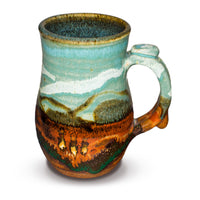 Stoneware mug. Handmade pottery. Turquoise-Brown color combination. Hand made by Prairie Fire Pottery.  Made in the U.S.A.   Right side view.