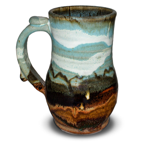 Glaze colors: turquoise-brown.  Handmade pottery stoneware mug.  20 ounce wheel-thrown pottery.  