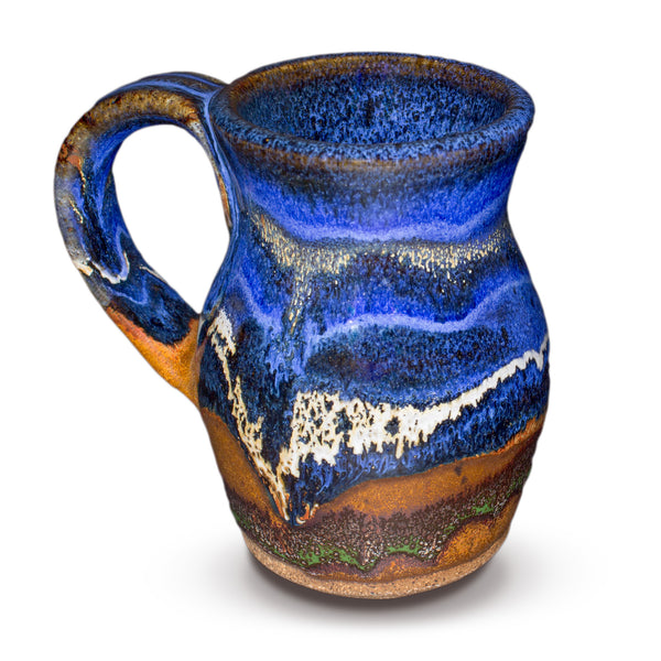 This is a 14 ounce wheel-thrown stoneware mug in earth tone and cobalt blue colors.  It is handmade pottery by Prairie Fire Pottery.  This is a side view of the mug.