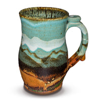 Handmde 24 ounce pottery mug.  Turquoise and brown colors.  Hand made by Prairie Fire Pottery.  Right side view.