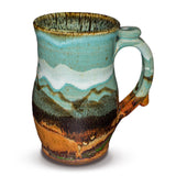 Handmde 24 ounce pottery mug.  Turquoise and brown colors.  Hand made by Prairie Fire Pottery.  Right side view.