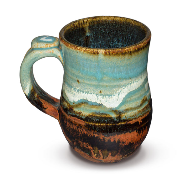 Turquoise and brown stoneware mug. Wheel-thrown. Handmade pottery by Prairie Fire Pottery. 12 ounce size.  This  is the left side view.