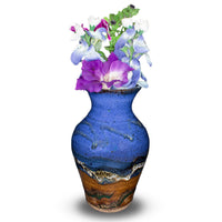 7 inch tall handmade pottery vase in cobalt blue and brown colors. Hand made by Prairie Fire Pottery in the U.S.A. View with garden flowers in the vase.