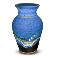 A classic flared-neck vase by Prairie Fire Pottery in a blend of cobalt blues and black.  Handmade pottery crafted in stoneware clay.  Made in the U.S.A.