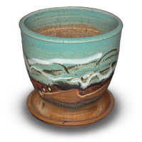 Small planter with a 4 inch diameter. Ideal for succulents. Glazed in turquoise and brown colors. Handmade pottery by Prairie Fire Pottery. Hand made in the U.S.A.