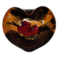 Heart-shaped bowl with red over toasted orange and black.  Handmade pottery.  Stoneware clay.  Hand made by Prairie Fire Pottery.  Overhead view.