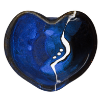 Cobalt blue and black bowl in the shape of a heart.  It's handmade pottery from Prairie Fire Pottery.  Hand made in stoneware clay.  Overhead view.