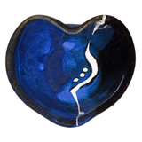 Cobalt blue and black bowl in the shape of a heart.  It's handmade pottery from Prairie Fire Pottery.  Hand made in stoneware clay.  Overhead view.