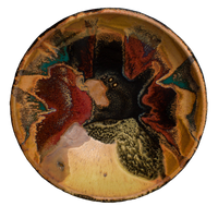 9 inch wheel-thrown bowl in beautiful earth tones and red. Hand crafted in stoneware clay and high-fired to 2400°. Handmade pottery by Prairie Fire Pottery.  Frontal view.
