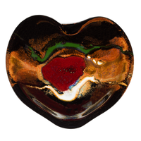 Heart-shaped bowl in toasted orange and black with red accents. Handmade pottery by Prairie Fire Pottery.  Overhead view.